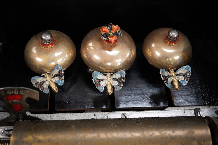 A 19th century Swiss cylinder music box, in a walnut and kingwood cross banded case, with 43 tooth cylinder (missing one tooth), and three bells with butterfly hammers, playing eight airs, cylinder 15.5cm long, case 48cm